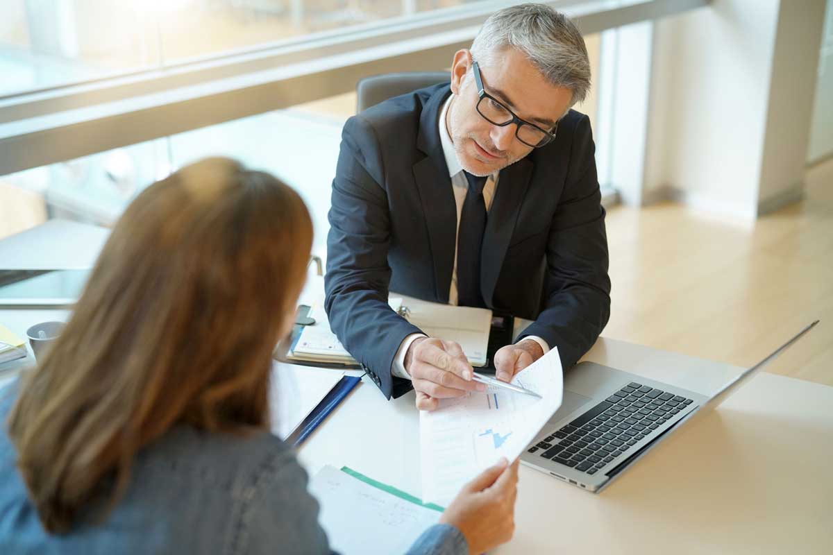 Advisor and client reviewing figures